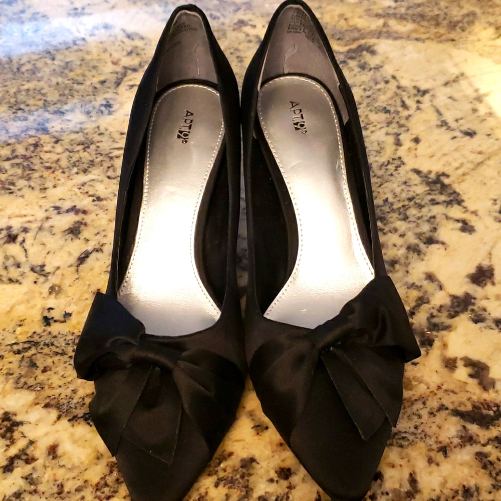 Black satin pumps